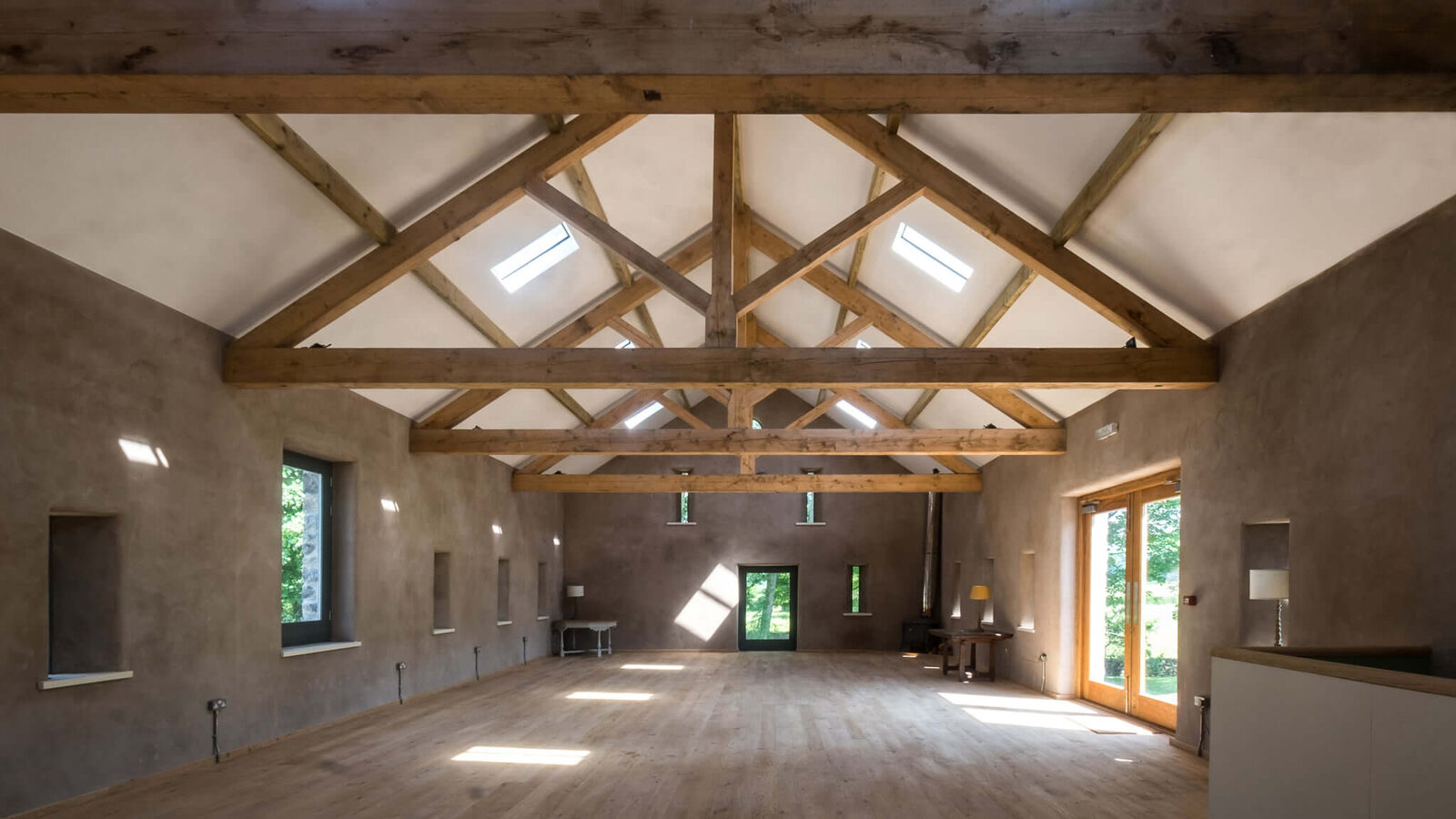 The restored barn interior with exposed trusses
